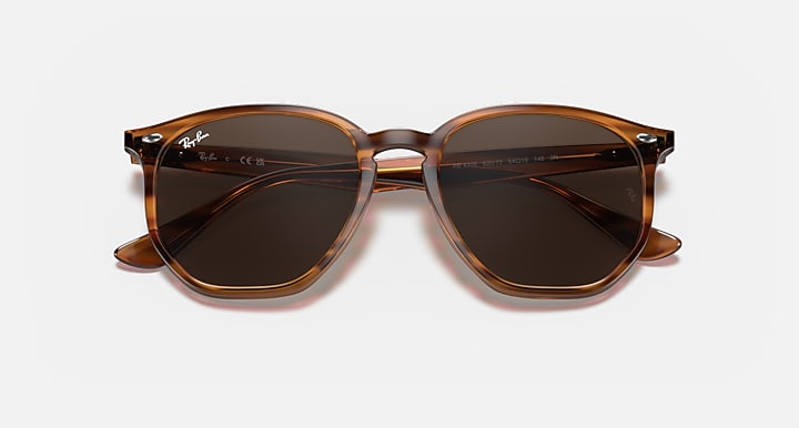 Hexagonal sunglasses front view with dark brown frame and dark lenses