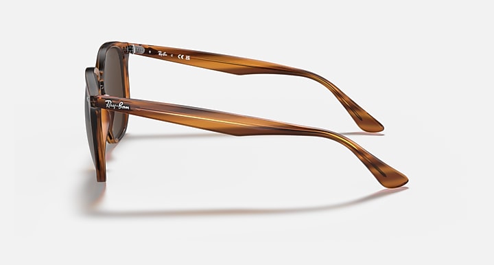 Hexagonal sunglasses side view with light havana frame and dark brown lenses