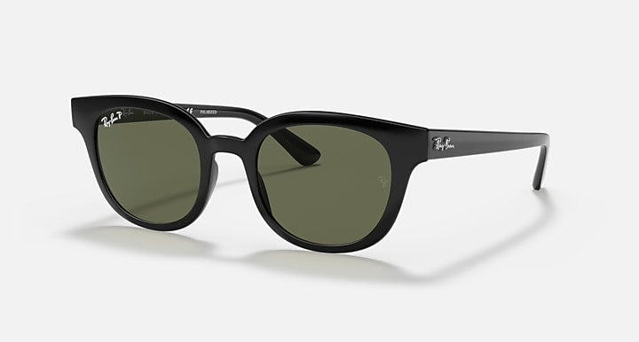 Ray-Ban round sunglasses with dark frames and green-tinted lenses