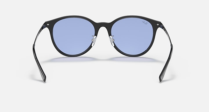 Black round sunglasses with blue lenses and metal hinge detail