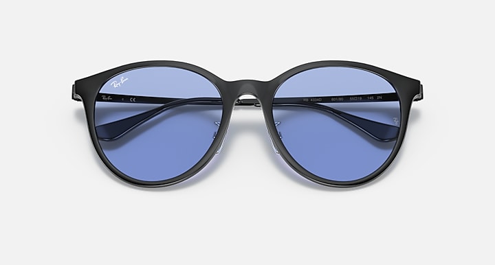 Black round sunglasses with blue lenses, front view and temple branding