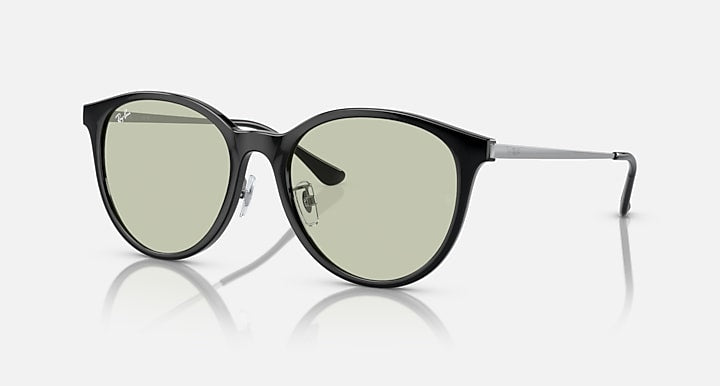 Ray-Ban RB4334D sunglasses with dark round frames and green-tinted lenses