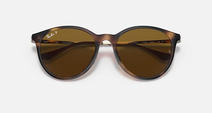 Light Havana round sunglasses with brown lenses, front view and temple branding