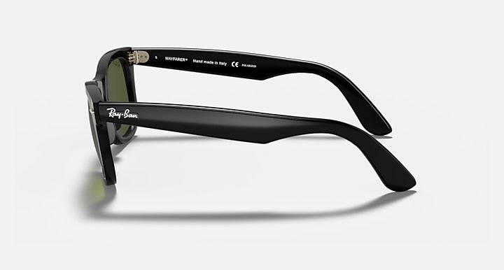 Ray-Ban Wayfarer sunglasses, black frame with dark green lenses, side profile view