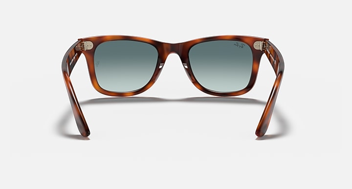 Ray-Ban Wayfarer sunglasses, tortoiseshell frame with blue-tinted lenses, front view