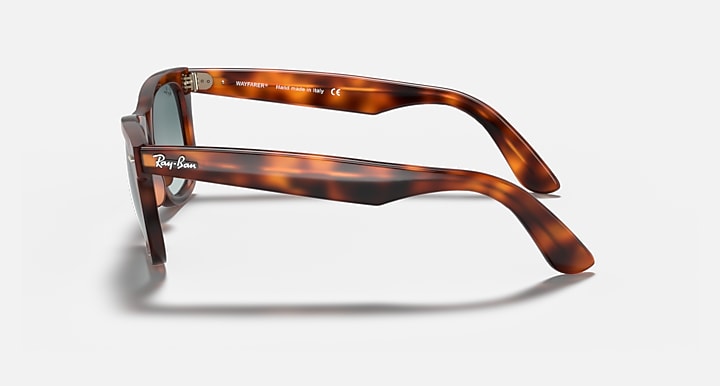 Ray-Ban Wayfarer sunglasses, tortoiseshell frame with blue-tinted gradient lenses, side view