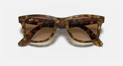 Ray-Ban Wayfarer sunglasses with brown-tinted gradient lenses and light Havana frames