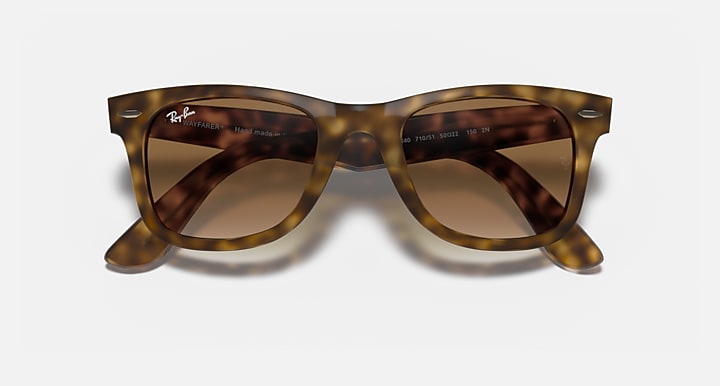 Ray-Ban Wayfarer sunglasses with brown-tinted gradient lenses and light Havana frames