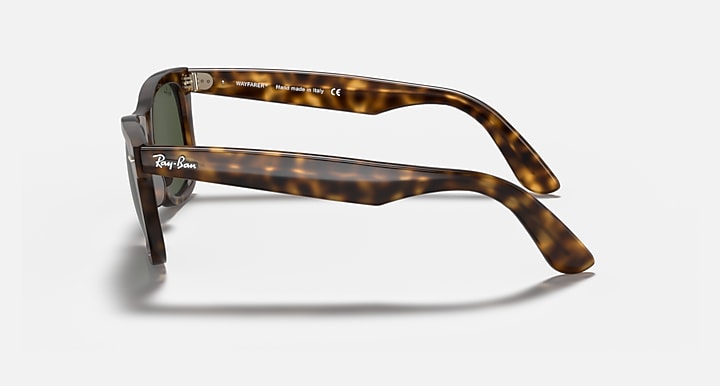 Ray-Ban Wayfarer sunglasses, side view, dark green lenses on light Havana frames