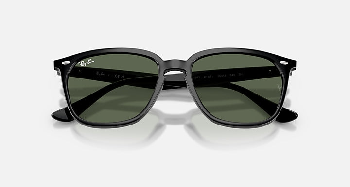 Ray-Ban RB4362 sunglasses with green lenses, black frame, angled front view