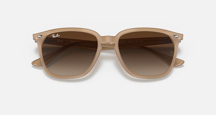 Ray-Ban sunglasses with warm brown frames and dark brown lenses, front view