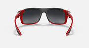 Red and black aviator-style sunglasses with dark lenses and adjustable nose bridge