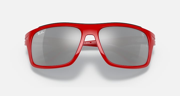 Red aviator-style sunglasses with gray mirrored lenses