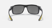 Dark gray aviator-style sunglasses with gray lenses and yellow side accents