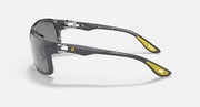 Dark gray aviator sunglasses with yellow accents and gray tinted lenses, side view