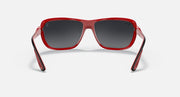 Red aviator sunglasses front angle with dark gray lenses and thick frame arms