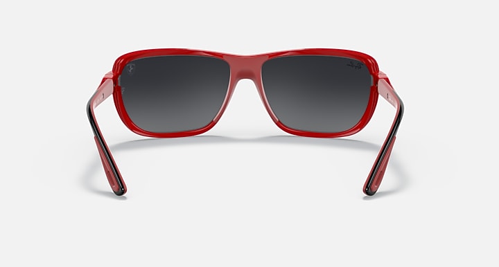 Red aviator sunglasses front angle with dark gray lenses and thick frame arms