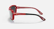 Red aviator sunglasses side view with dark gray lenses and adjustable nose bridge