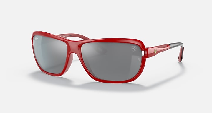 Red aviator sunglasses with dark gray lenses and metal hinges, full frame
