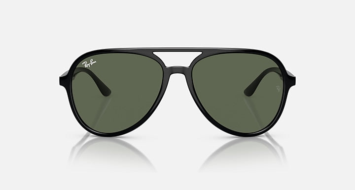 Sunglasses with dark frame and dark green lenses, front view aviator