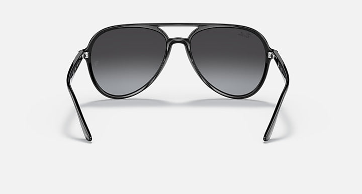 Ray-Ban aviator sunglasses with dark grey lenses and black metal frame.