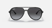 Ray-Ban aviator sunglasses with black frame and dark smoke tinted lenses.