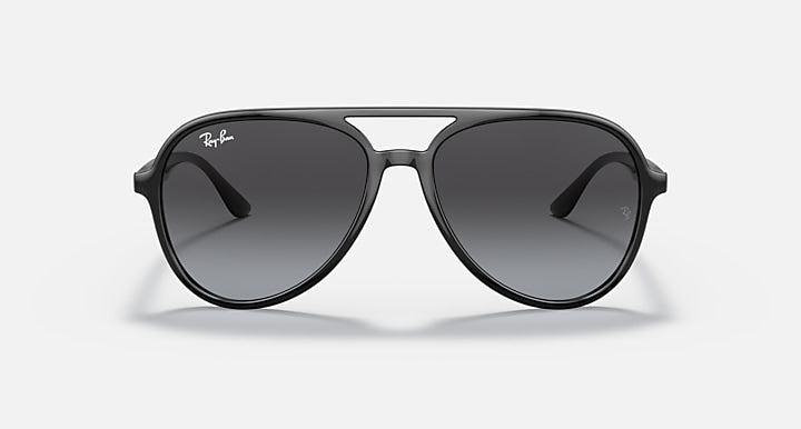 Ray-Ban aviator sunglasses with black frame and dark smoke tinted lenses.