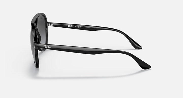 Ray-Ban aviator sunglasses in black with wrap-style arms and hinge details.