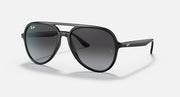 Ray-Ban aviator sunglasses with black frame and dark grey gradient lenses.