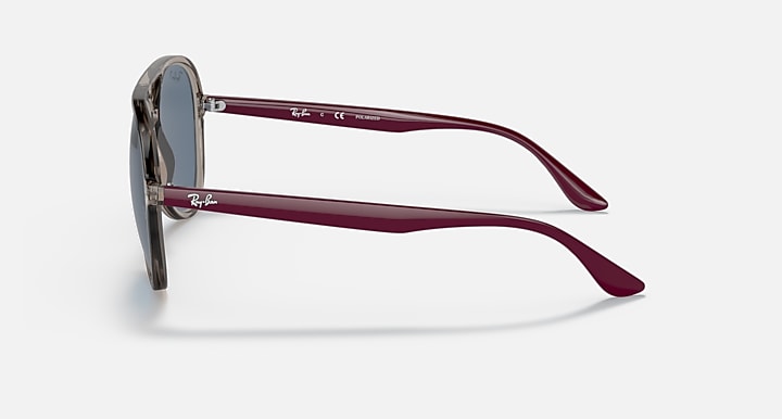 Ray-Ban aviator sunglasses with maroon frame and dark blue tinted lenses.