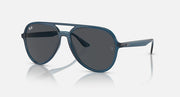 Ray-Ban aviator sunglasses with dark gray lenses and blue frame, angled front view.