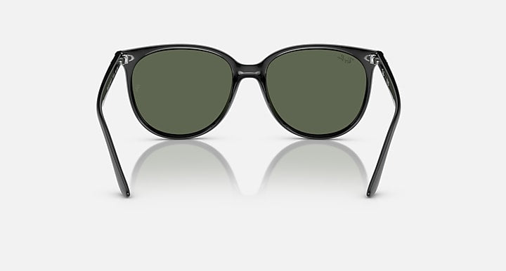 Black sunglasses front view with olive-green lenses and curved arms