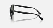 Black sunglasses side view with olive-green tinted lenses and curved temples