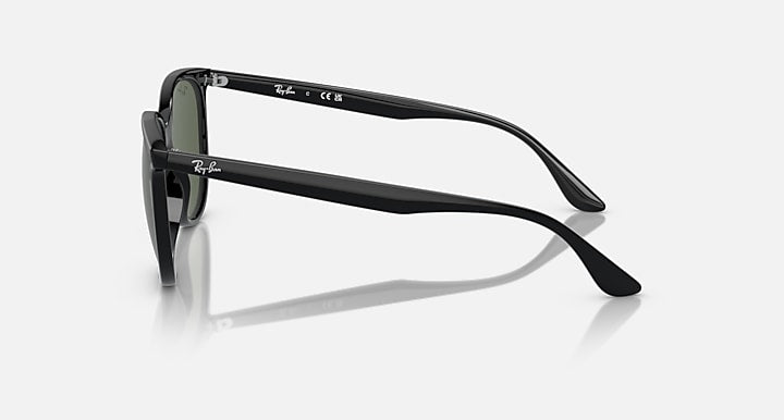 Black sunglasses side view with olive-green tinted lenses and curved temples