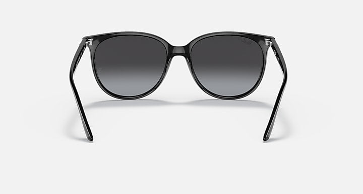 Black sunglasses front view with dark gray lenses and center bridge