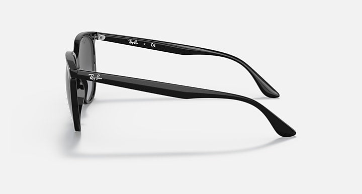 Black sunglasses side view with curved temples and dark tinted lenses