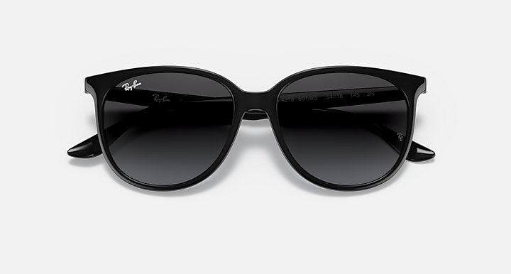 Black cat-eye sunglasses with dark lenses and angled top rim