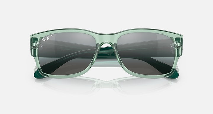 Ray-Ban RB4388 sunglasses with transparent green frame and dark tinted lenses front view