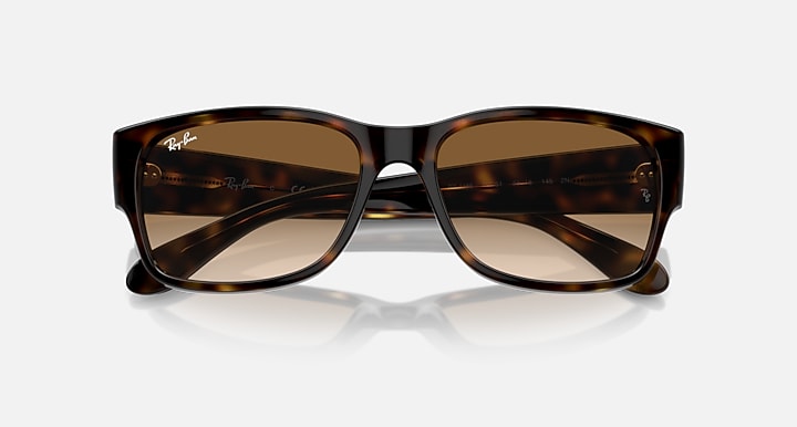 Tortoiseshell sunglasses with brown gradient lenses and Ray-Ban logo accents