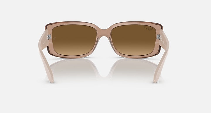 Ray-Ban sunglasses front view with translucent brown frames and brown lenses.