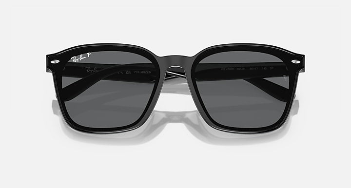 Ray-Ban black square sunglasses with gray lenses, angled view of frame and temples