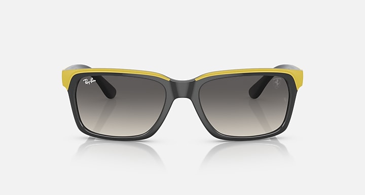 Ray-Ban RB4393M sunglasses, black frame with bright yellow top bar and grey gradient lenses