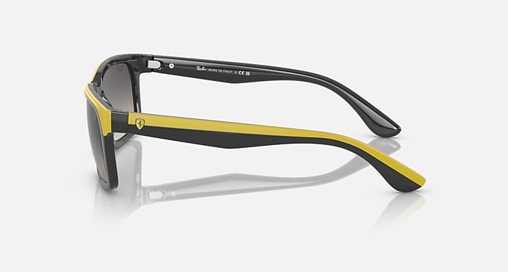 Ray-Ban RB4393M sunglasses side view, black frame with yellow-green rubber arms