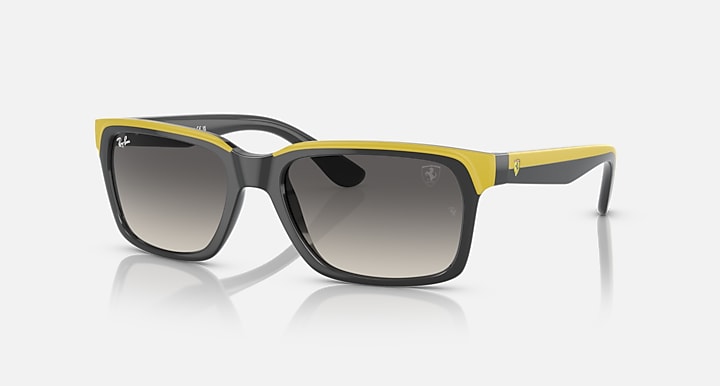Ray-Ban RB4393M sunglasses, black frame with yellow-green rubber and grey gradient lenses