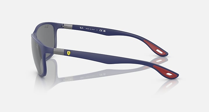 Ray-Ban RB4394M sunglasses, side view of matte blue frame with dark lenses