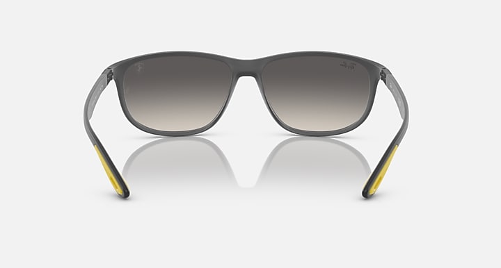 Ray-Ban RB4394M sunglasses, front view with dark frame and yellow temple tips