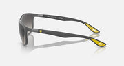 Ray-Ban RB4394M sunglasses, side view with dark frame and gold temple accents