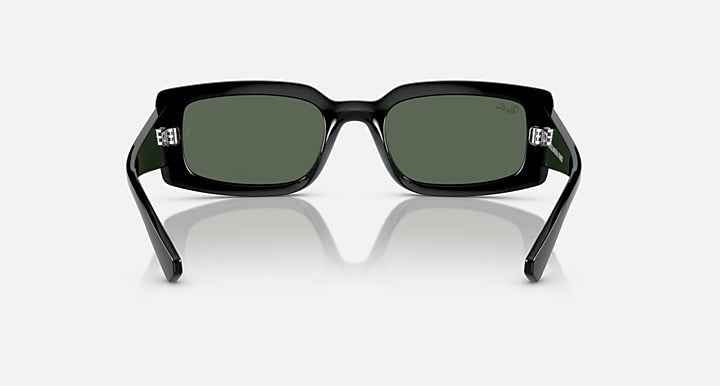 Black rectangular sunglasses with dark green lenses and sculpted bridge