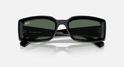 Black sunglasses with dark green lenses and thick wraparound frame