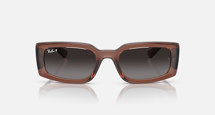 Translucent brown sunglasses with dark brown lenses, bold square frame